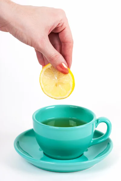 Hand holding a piece of lemon — Stock Photo, Image