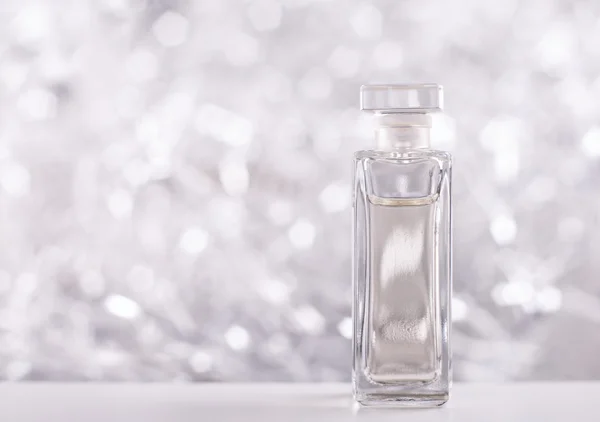 Een Fles Parfum Mousserende Achtergrond — Stockfoto