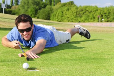 Young Golfer on green clipart