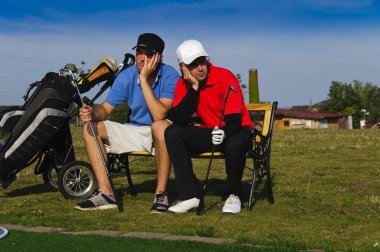Two young golfers are frustrated clipart