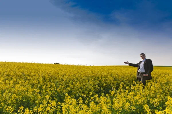 Adult Manager Suit Stands His Laptop Computer Yellow Flowering Rape — Stock Photo, Image