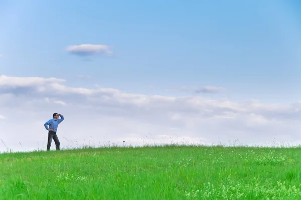 Businessman Suit Standing Meadow Looks Distance Front Clouds — Stock Photo, Image