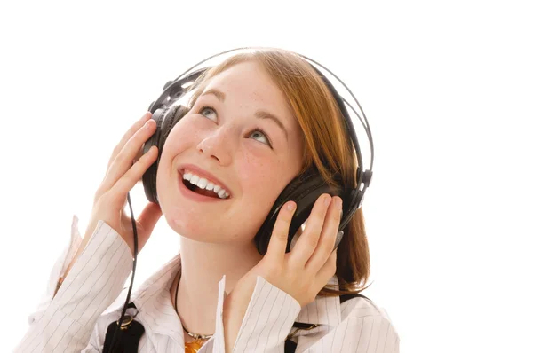 Een leuk meisje luisteren muziek — Stockfoto