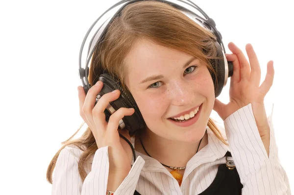 Egy aranyos lány hallgat zenét — Stock Fotó