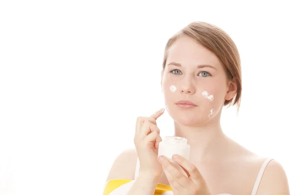 Cute girl with lotion — Stock Photo, Image