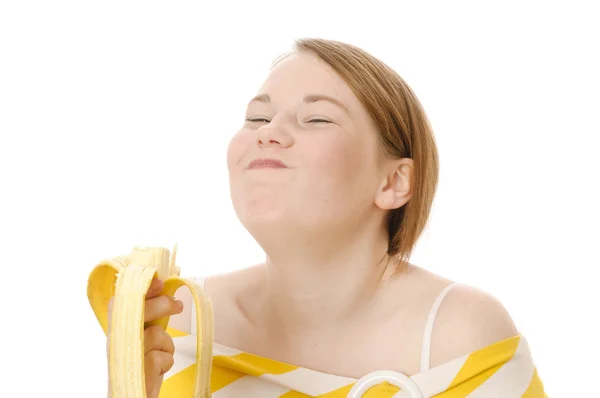 Aranyos lány eszik friss gyümölcsöt — Stock Fotó