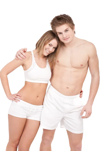 Fitness - Young sportive smiling couple on white — Stock Photo, Image