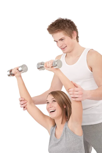 Fitness - Jovem com pesos de elevação de instrutor — Fotografia de Stock