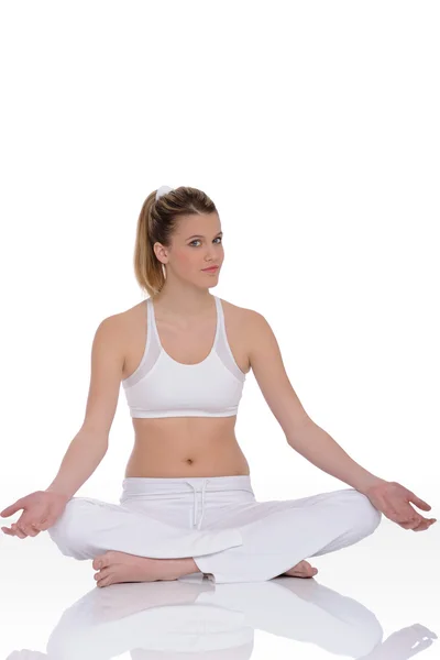 Fitness - Young woman in yoga position on white — Stock Photo, Image