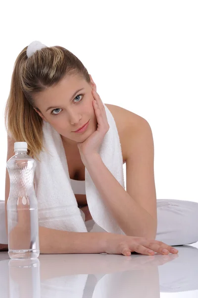 Fitness - Young sportive woman with water and towel — Stock Photo, Image
