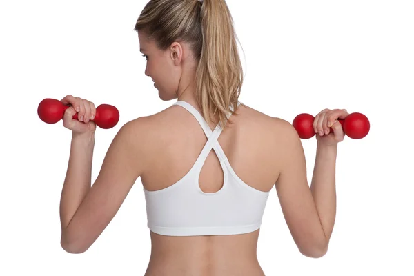 Fitness - junge sportliche Frau trainiert mit Gewichten — Stockfoto