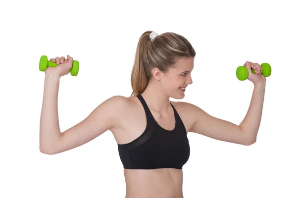 Fitness - junge sportliche Frau trainiert mit Gewichten — Stockfoto