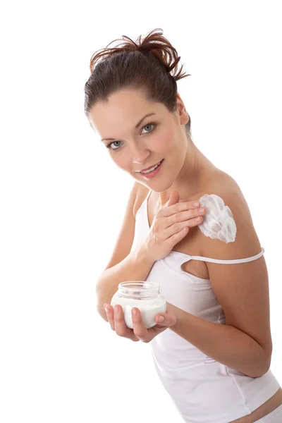 Body care series - Beautiful young woman applying cream — Stock Photo, Image