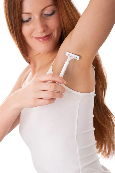 Body care series - Smiling red hair woman shaving her armpit — Stock Photo, Image