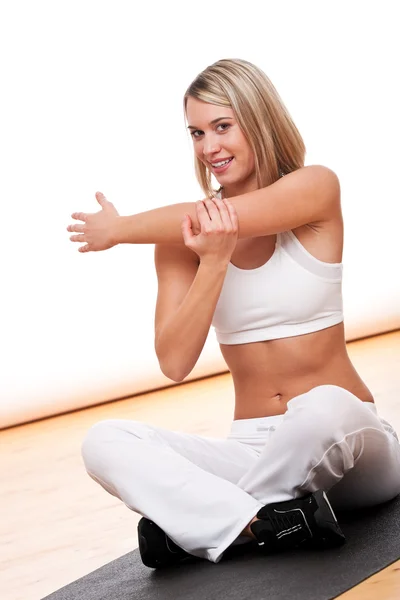 Young Woman Stretching Black Mat — Stock Photo, Image
