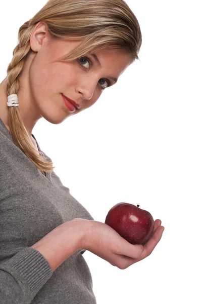 白い背景に赤いりんごを持つ女性は — ストック写真