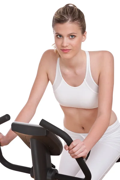 Fitness series - Woman on exercise bike — Stock Photo, Image