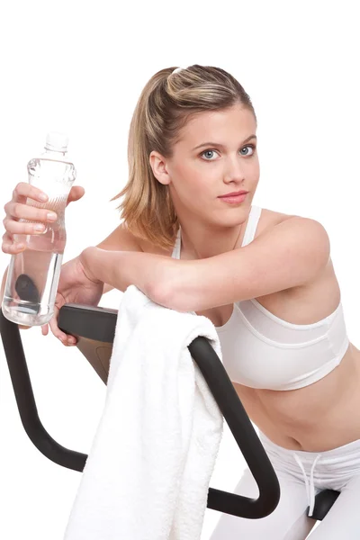 Fitness Series Woman Exercise Bike Bottle Water White Background — Stock Photo, Image