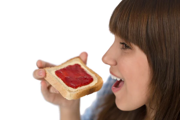 Happy Teenager Pajamas Eating Healthy Toast Breakfast White Background — Stock Fotó