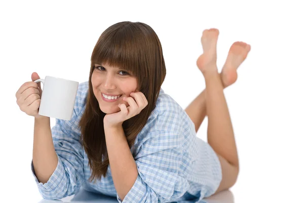 Female teenager in pajamas with cup of tea — Stock Photo, Image