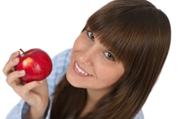 パジャマの白い背景の上の朝食健康リンゴを食べて幸せなティーンエイ ジャー — ストック写真