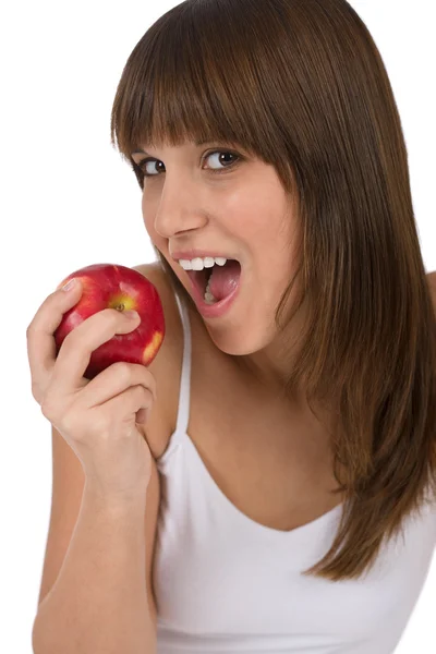 代の女性朝食白い背景の上にリンゴを食べる — ストック写真