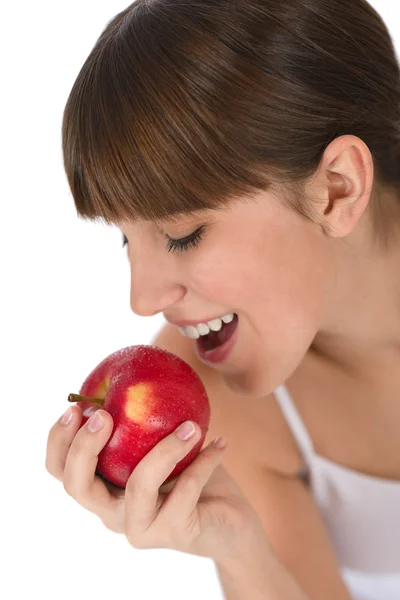 女性青少年在白色背景上早餐吃苹果 — 图库照片