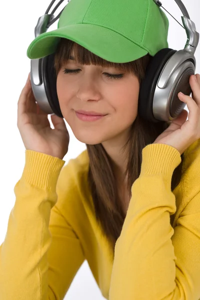 Kobiece kobieta młody nastolatek posłuchać muzyki w słuchawkach — Zdjęcie stockowe