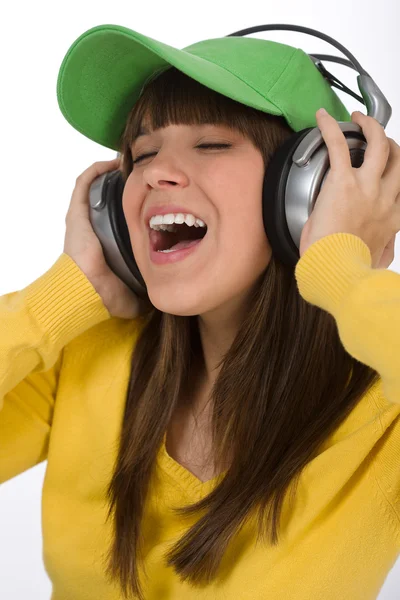 Happy female teenager enjoy music with headphones — Stock Photo, Image
