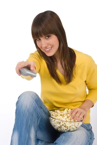Happy female teenager watching television — Stock Photo, Image