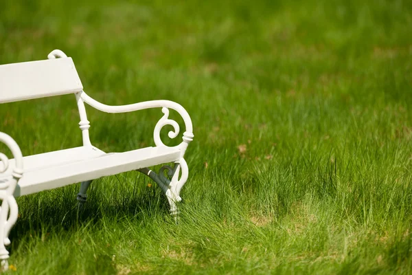 stock image Spring and summer - White romantic bench in meadow on sunny day