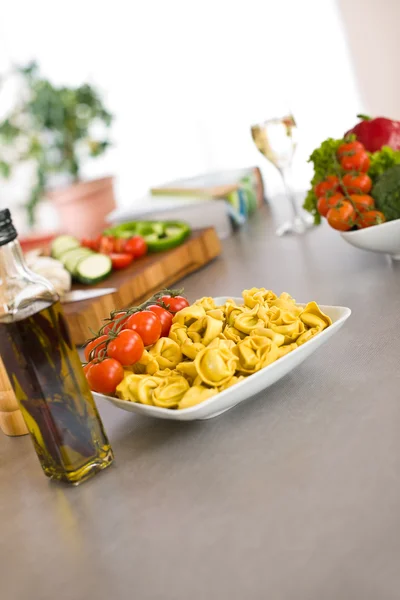 Cooking Italian food - pasta, tomato and olive oil — Stock Photo, Image