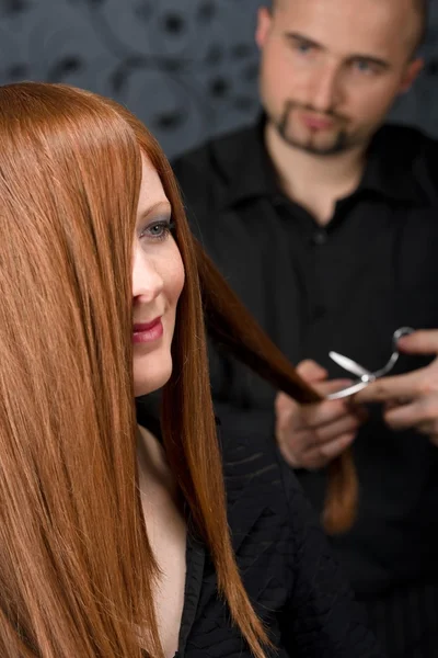 Professional hairdresser with fashion model at luxury salon — Stock Photo, Image