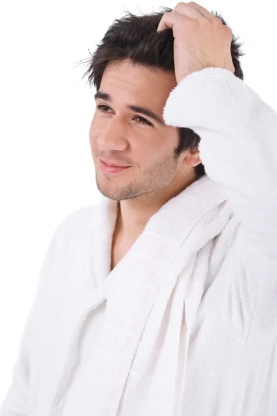 的年轻人在用在白色背景上醒来的毛巾浴袍 — 图库照片