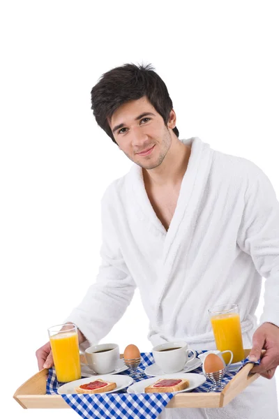 Breakfast - young man holding tray with breakfast — Stock Photo, Image
