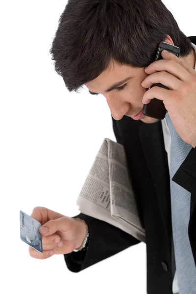 Jovem Empresário Segurando Telefone Celular Jornal Cartão Crédito Fundo Branco — Fotografia de Stock