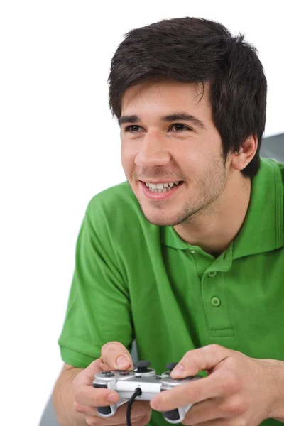 stock image Young happy man playing video game with control pad