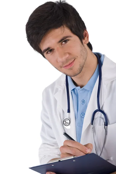 男学生医生用听诊器在白色背景上写 — 图库照片