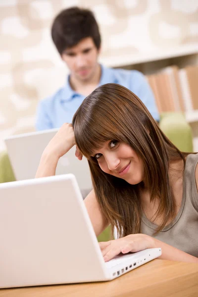 Student - two teenager with laptop in living room — Stock Photo, Image