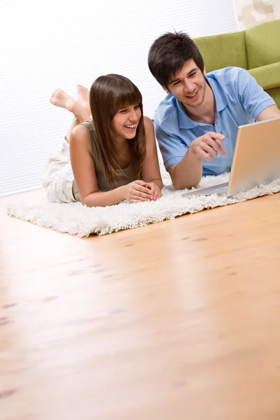 Student - two teenager with laptop in living room — Stock Photo, Image