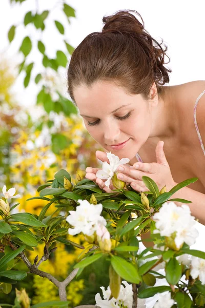 Gardening - Woman smelling blossom flower — Stock Photo, Image