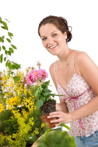 白い背景の上の植木鉢を保持している女性の笑みを浮かべて — ストック写真