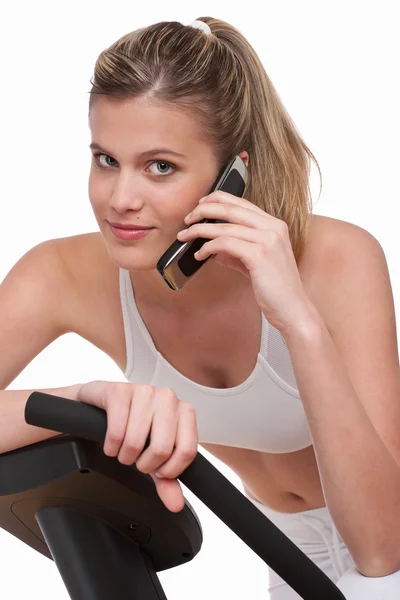 Fitness Serie Frau Mit Handy Auf Weißem Hintergrund lizenzfreie Stockfotos