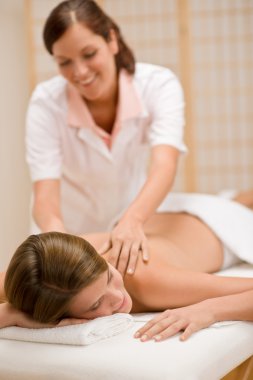 Body care - woman back massage at day spa