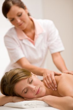 Body care - woman back massage at day spa