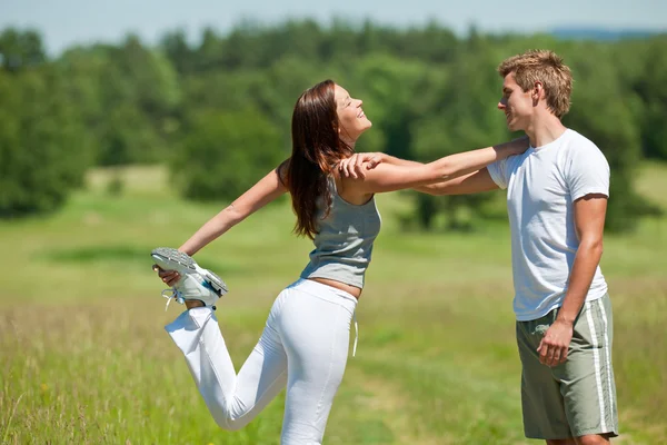 Young Man Woman Exercising Spring Meadow Sunny Day — Stock Photo, Image