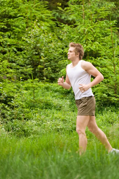 Junger Mann Joggt Sportlichem Outfit Der Natur — Stockfoto
