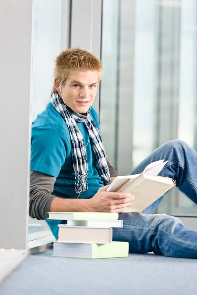 Young Man Earbuds Books Modern Glass Building — Stock Photo, Image