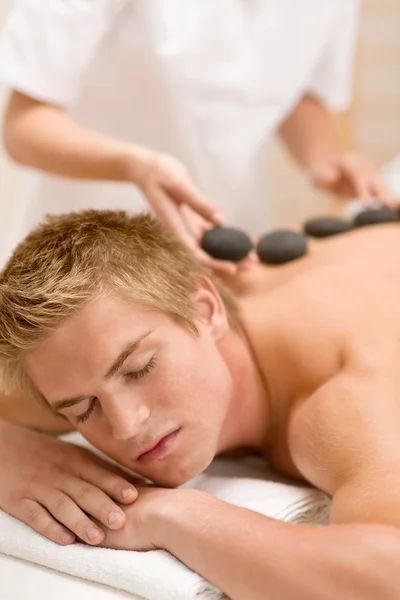 Lastone therapy - man at luxury massage — Stock Photo, Image