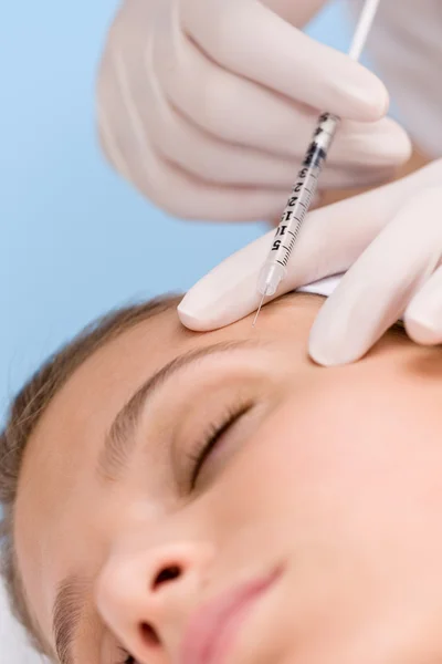 Botox injection - woman in cosmetic medicine treatment — Stock Photo, Image